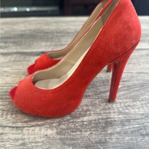 Christian Louboutin red suede pumps 
Size 35